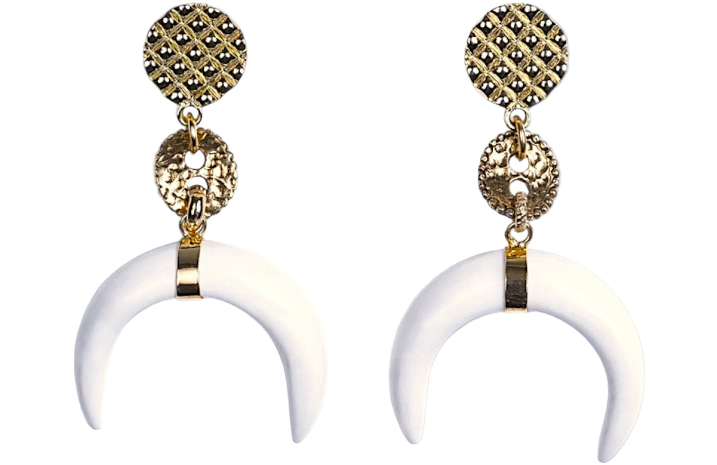 Pair of gold and white horn-shaped earrings on a white background