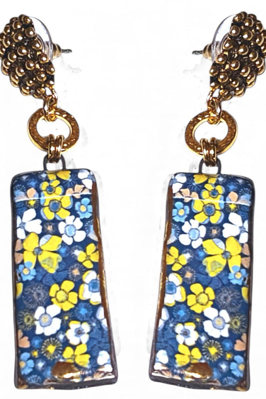 Floral patterned earrings with gold accents on a white background