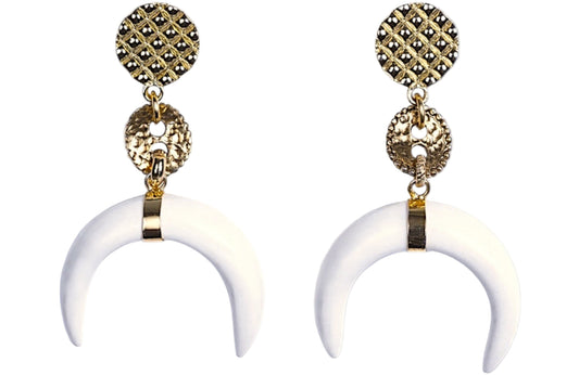 Pair of gold and white horn-shaped earrings on a white background